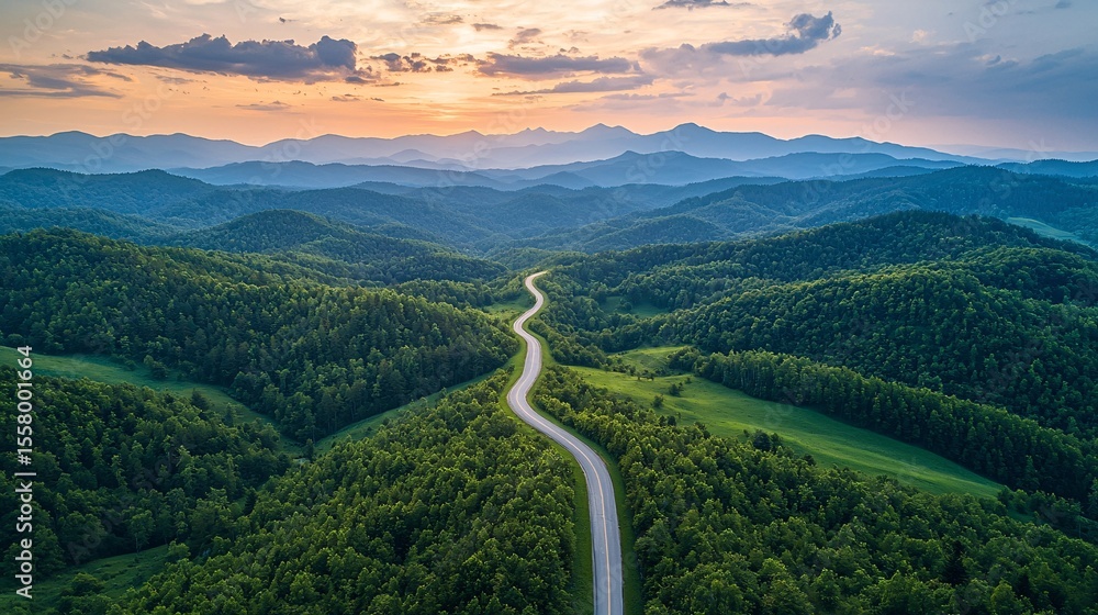 The winding mountain road leads to the distance The winding mountain road leads to the distance