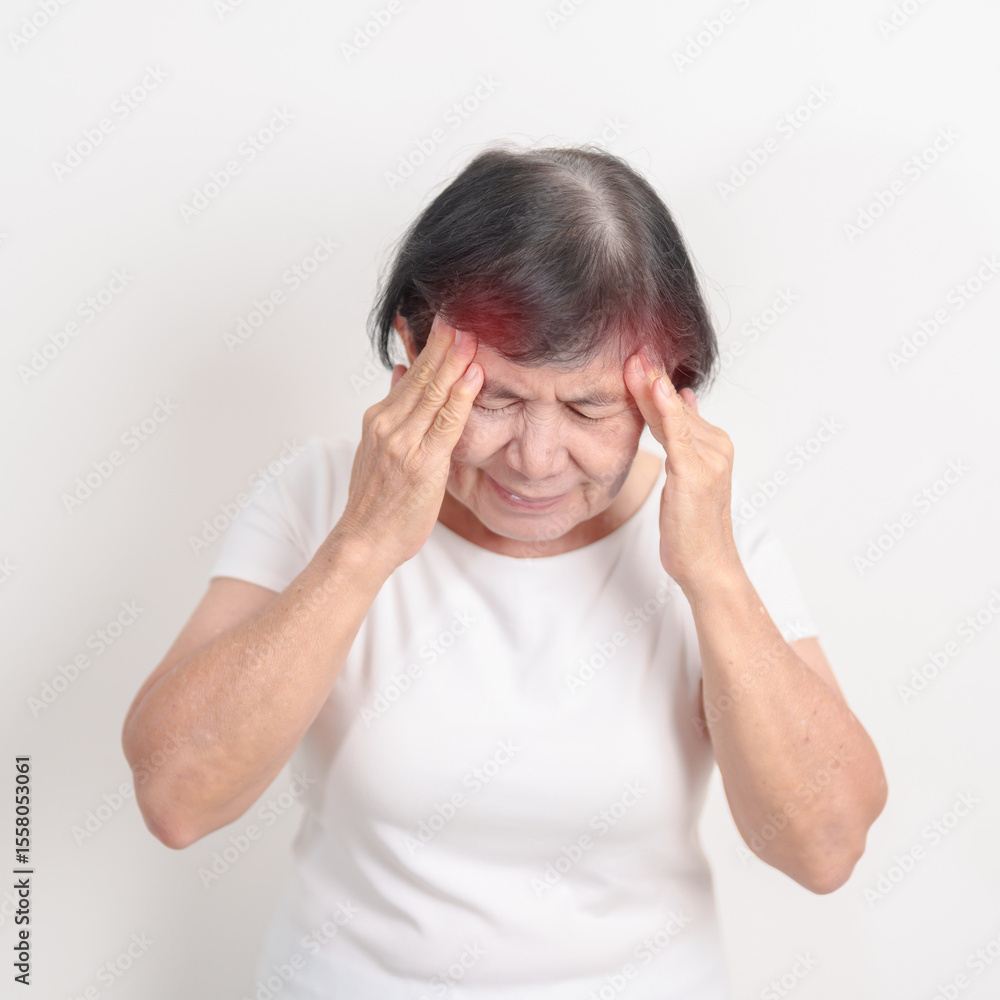 Naklejka premium Elderly Woman having headache and Dizzy for concepts of Chronic Stress, Headache and Migraine, World Brain Tumor day, Brain Cancer, Brain Stroke, Dementia, alzheimer, Hypotension and mental health