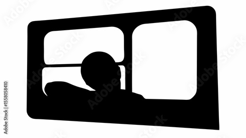 Silhouette of a person looking out of a window with a multi pane design in black and white colors