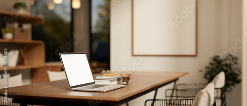 Wallpaper Mural White screen laptop aside books and coffee cup on wooden dining table in a cafe or family restaurant Torontodigital.ca