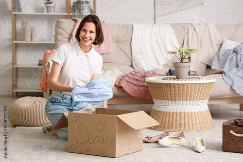 Young pretty woman packing ...