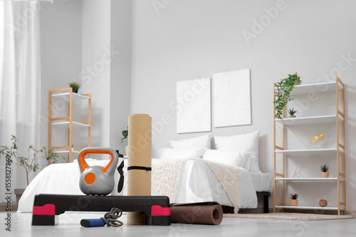 Sports equipment on floor in bedroom