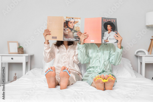 Young women in pajamas with...