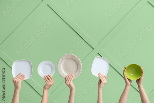 Multiple hands holding asso...