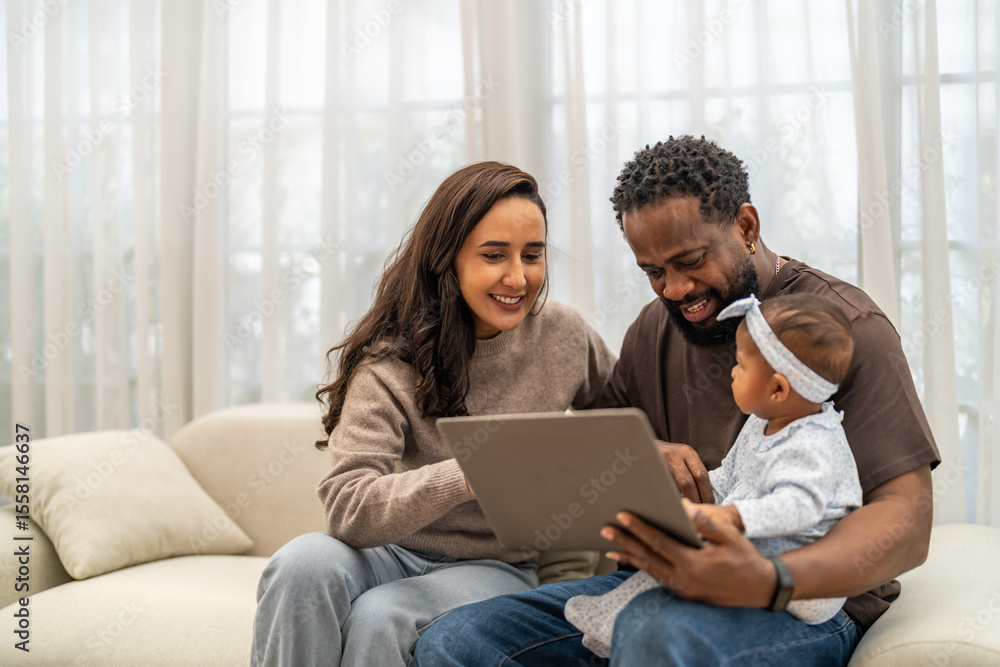 African love family happy time at home, father showing baby a tablet with cartoons for early childhood learning and development, mother smiling engaging in digital parenting and interactive education African love family happy time at home, father showing baby a tablet with cartoons for early childhood learning and development, mother smiling engaging in digital parenting and interactive education