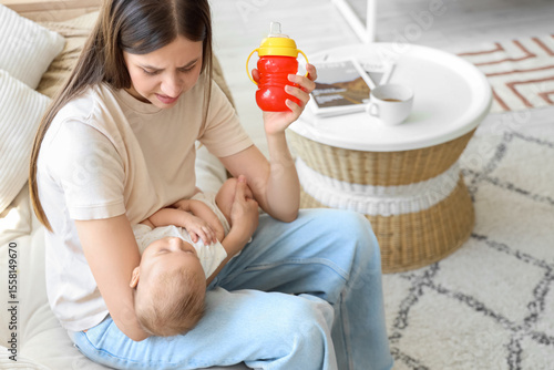Young mother suffering from...