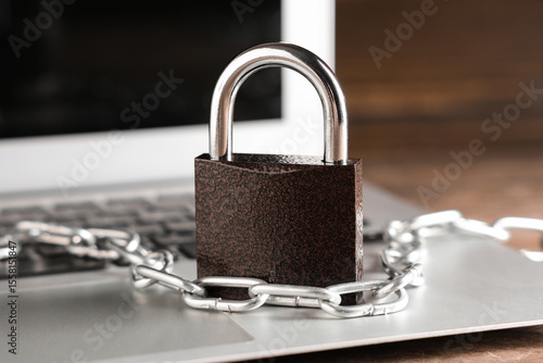 Padlock with chain on lapto...