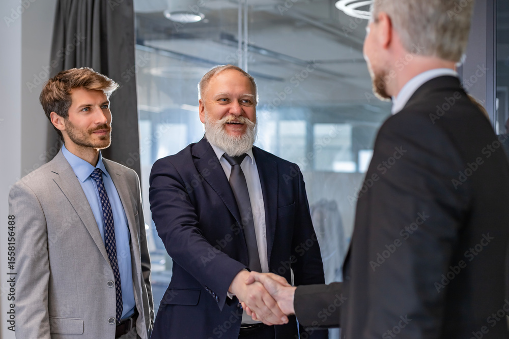 Businessmen shaking hands during a meeting. Businessmen shaking hands during a meeting.