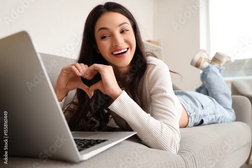 Young woman video chatting ...