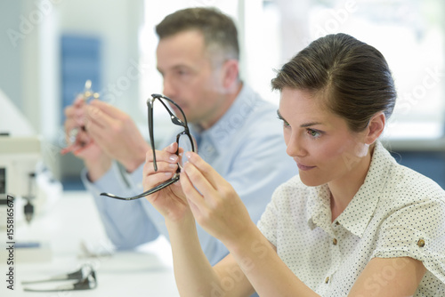 Wallpaper Mural woman fixes glasses in the laboratory Torontodigital.ca