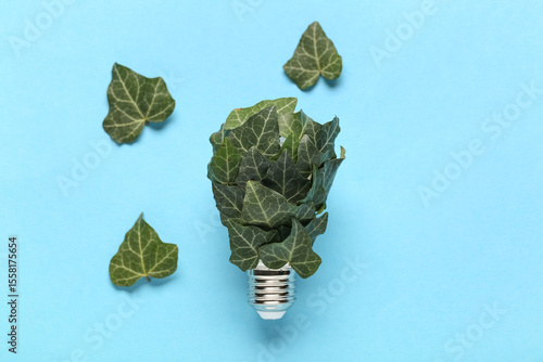 Light bulb with plant leave...