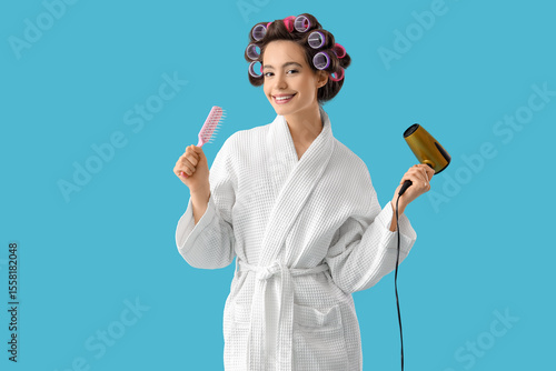 Young woman in bathrobe wit...