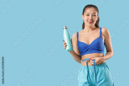 Sporty young Asian woman wi...