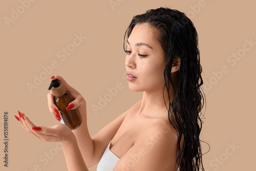 Pretty young Asian woman wi...