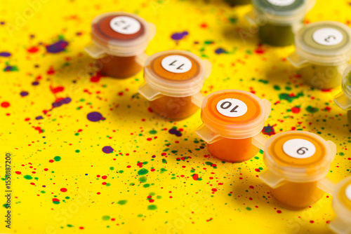 Set of cans with paints on ...