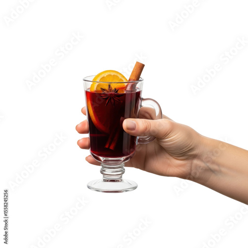 A hand holds a clear glass mug filled with spiced mulled wine, garnished with orange, cinnamon, and star anise. Ideal for winter, holiday, and cozy themes.