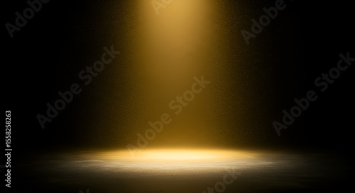Golden spotlight on a dark stage