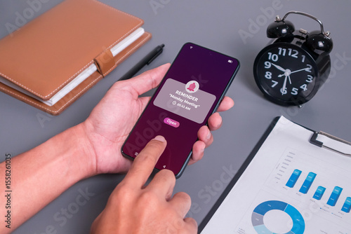 Monday Meeting reminder notification on mobile phone screen. New event notice message on mobile phone.