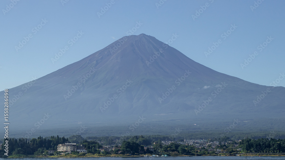 Naklejka premium Mount fuji san at Lake kawaguchiko in japan on Day.Fisherman with beautiful sunrise mood of Fuji Mountain at Yamanaka lake.