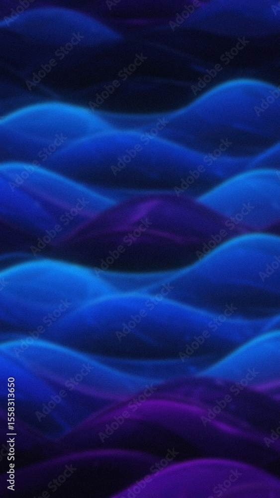 Fototapeta premium Abstract wavy patterns in shades of blue and purple create a flowing gradient background with a soft blurred effect