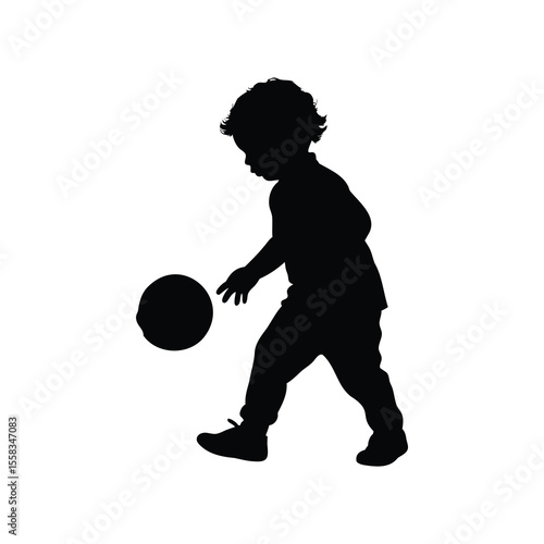 Silhouette of a toddler playing with a ball, learning coordination skills