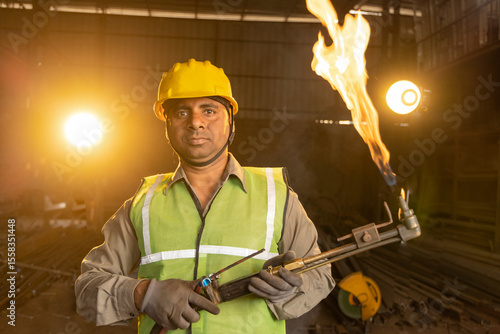 Canvas Print Handyman preparing his autogenous welding tool in workshop.