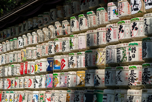 Obraz na plátně Straw-wrapped sake barrels stacked as offerings at Meiji Jing