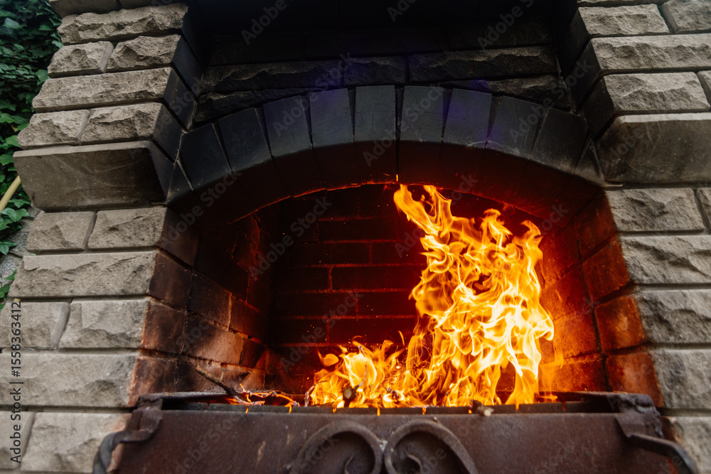 Close-up of a bright fire in a barbecue. Close-up of a bright fire in a barbecue.