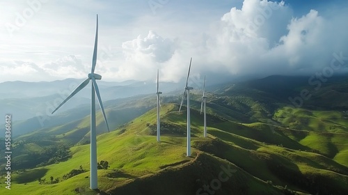 Majestic wind turbines stand tall on rolling green hills against a vibrant sky, showcasing clean energy generation in a picturesque landscape