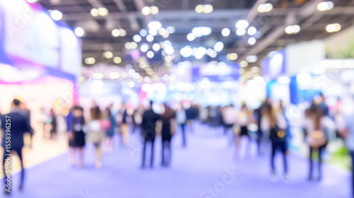 Wallpaper Mural Vibrant atmosphere in an exhibition hall filled with people during a major trade show event Torontodigital.ca