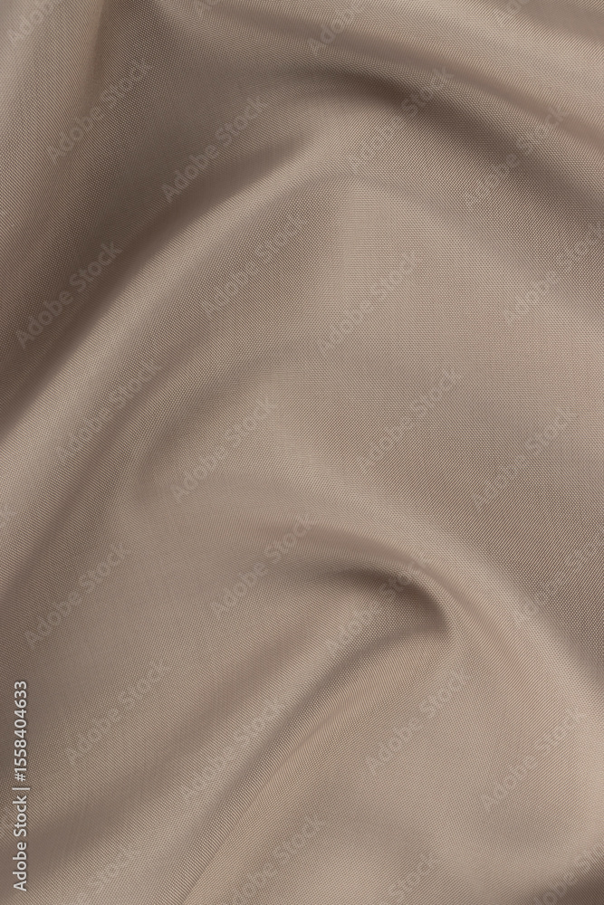 Obraz premium A close-up view of a beige cloth with textured fabric and subtle folds