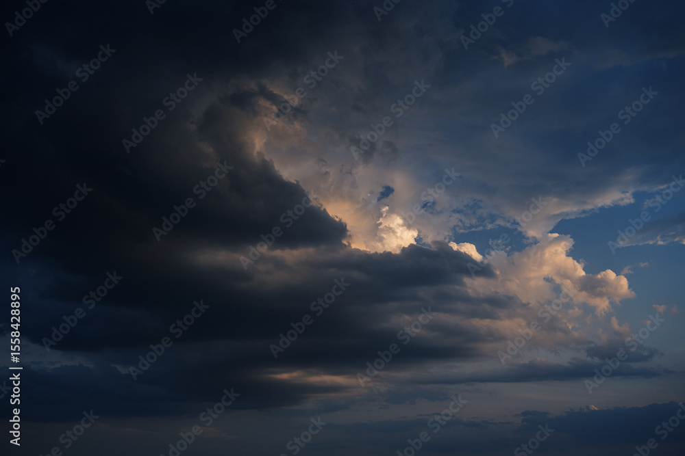 Dramatic sunset sky with light orange clouds. Dramatic sunset sky with light orange clouds.
