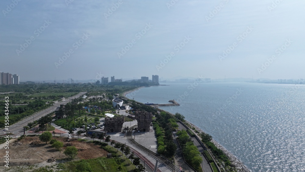 Fototapeta premium The skyline of Yeongjong Island, Incheon on a blue sky day, seen from the Seaside Park Yeongjong International City 
