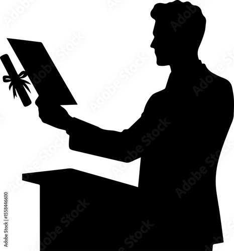 Man holding diploma while standing at podium in silhouette  