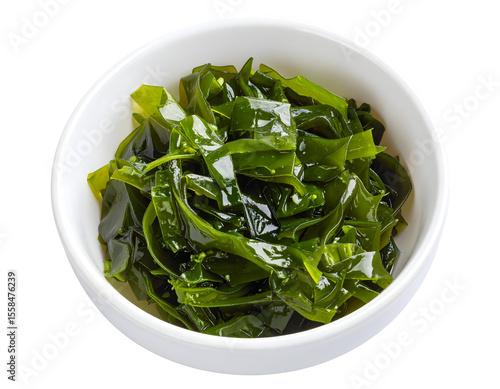 A pristine white bowl holds a generous serving of vibrant, glossy green seaweed, ready for a nutritious meal.