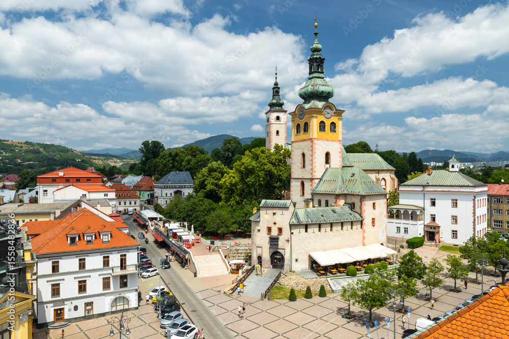 Fototapeta premium Church of the Assumption of the Virgin Mary dominating SNP Square in Banska Bystrica, Slovakia