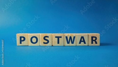 wooden blocks spelling postwar on blue background symbolizing recovery and peace after conflict, suitable for editorial use, branding, and war related content