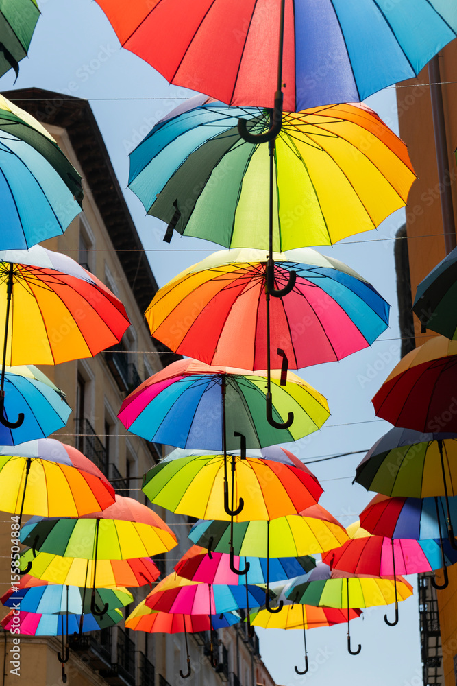 Obraz premium Multicolored umbrellas on the streets of Madrid, Spain