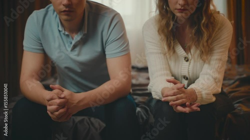 couple family relationship problems divorce silent do not speak, man and woman cry sitting at bed resentment towards each other in dark bedroom. guy cheated on girl. betrayal jealousy broken heart