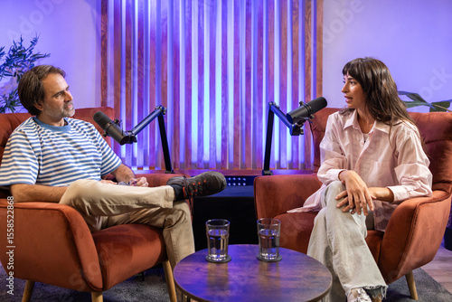 Intimate podcast recording studio with interview setup