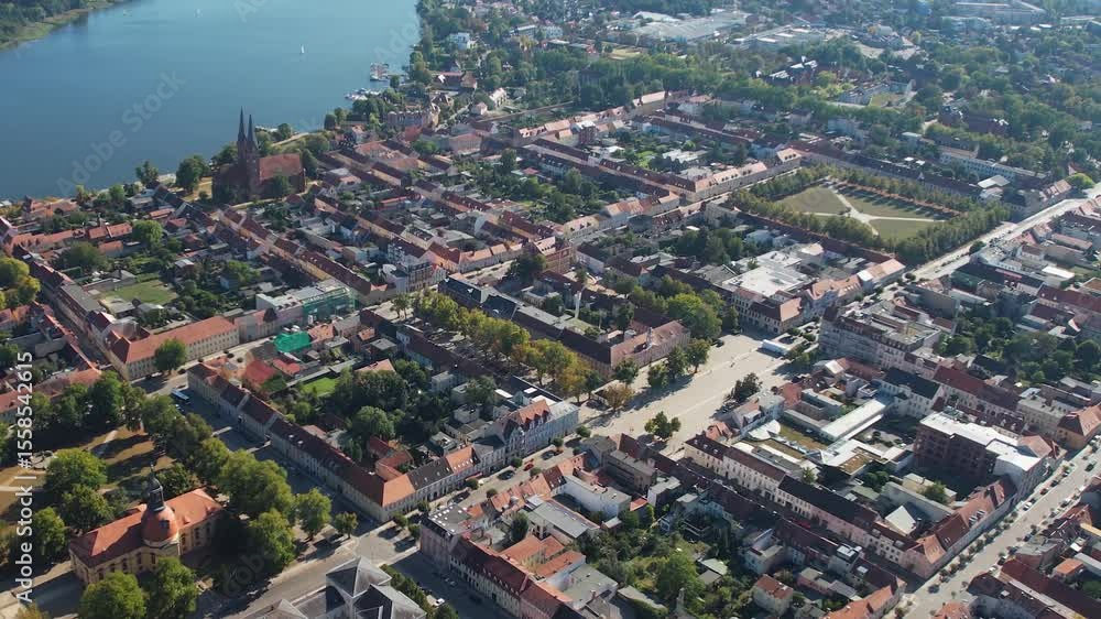 Aerial panoramic view around the old town of the city Neuruppin on a sunny noon in summer in Germany. Aerial panoramic view around the old town of the city Neuruppin on a sunny noon in summer in Germany.