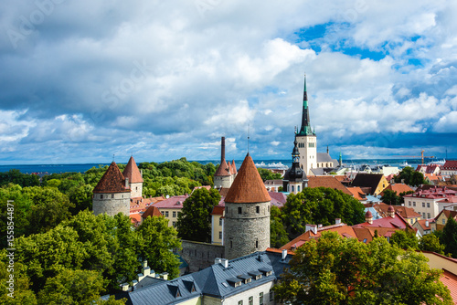 Tallinn Old Town panoramic view with medieval stone towers, red rooftops and St. Olaf's Church, seen from Patkuli Viewing Platform in Tallinn, Estonia.

