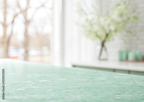 Soft focus on a pristine mint green surface