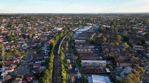 Drone Shot of Sydney Suburban Train at Sunset Flying Over Sefton to Lidcombe