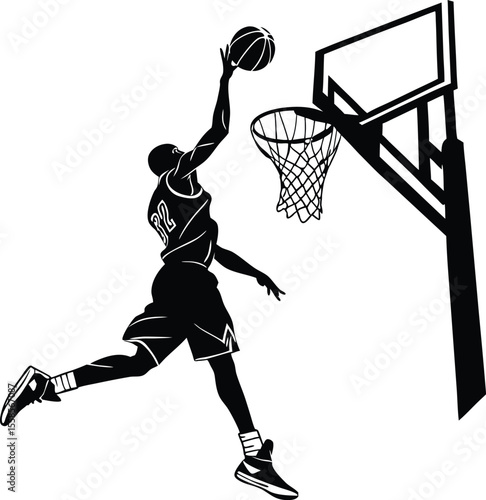 Silhouette of a basketball player performing a slam dunk at the hoop