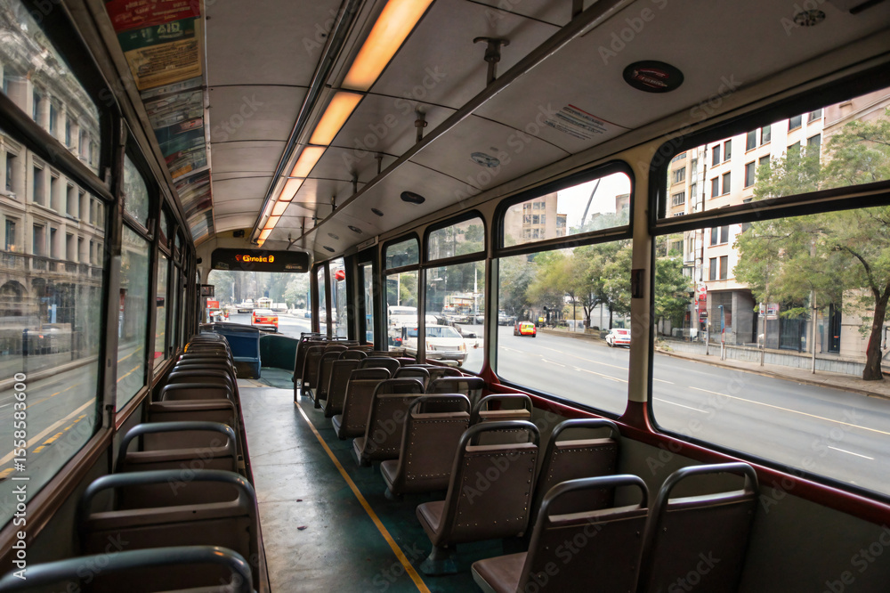 Fototapeta premium urban empty bus interior, public transport on the city street