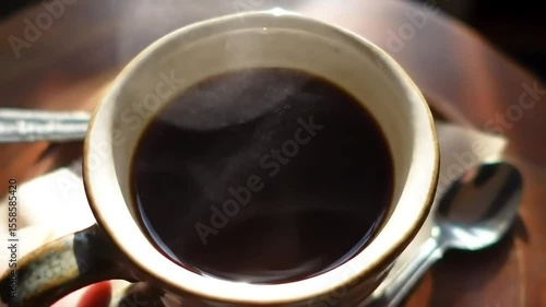 Steaming coffee cup, cafe, wood table