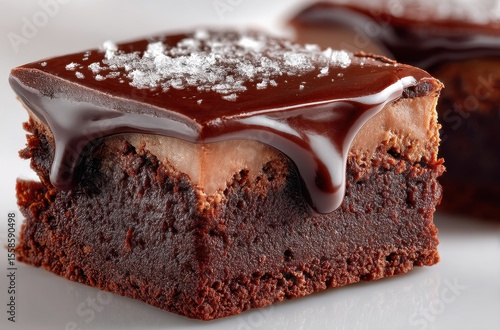 Deliciously Rich Chocolate Brownie with Smooth Layer of Chocolate Frosting and Light Dusting of Sugar Ideal for Dessert Lovers and Baking Enthusiasts