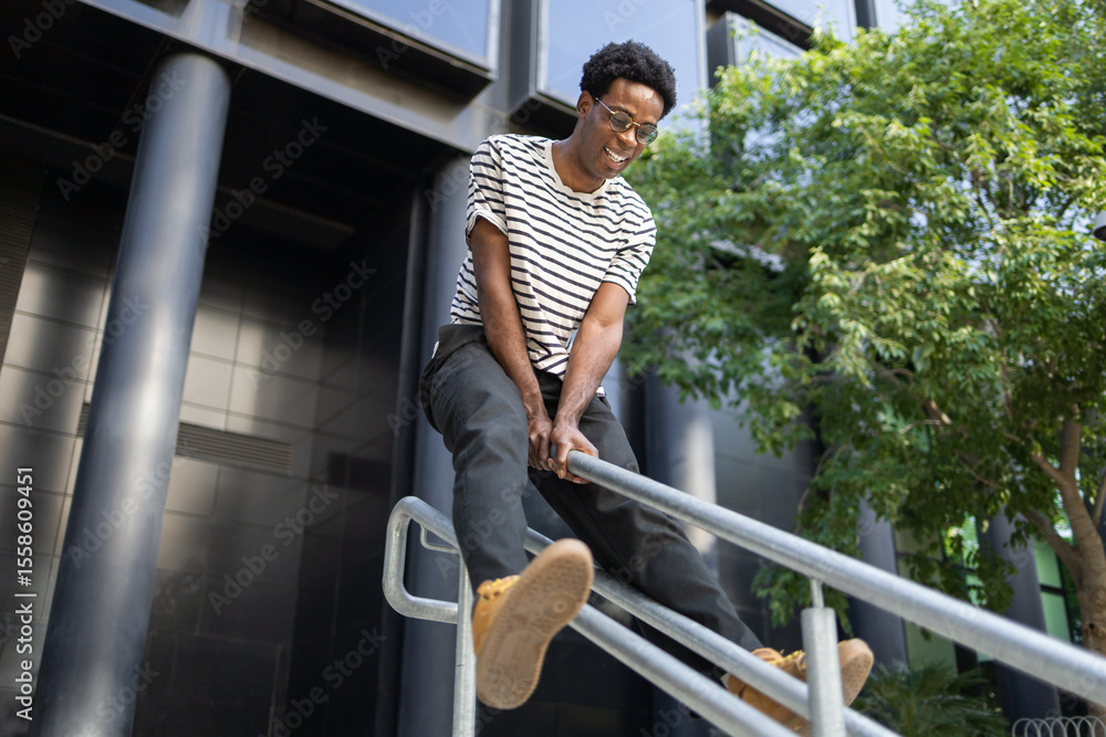 Student enjoying outdoor activity on urban railings Student enjoying outdoor activity on urban railings