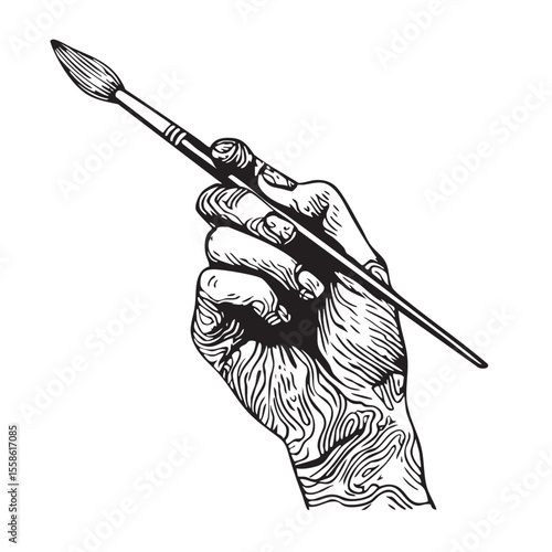 Hand holding a paintbrush for creative expression and artistry